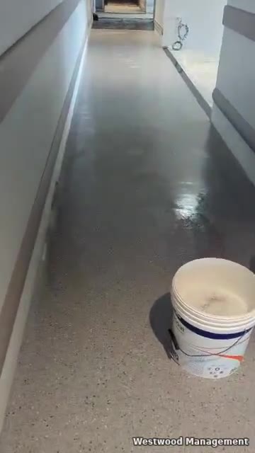 Corridor with newly laid speckled vinyl flooring in Kampala